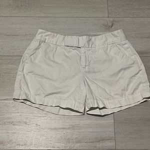 Calvin Klein, white shorts.